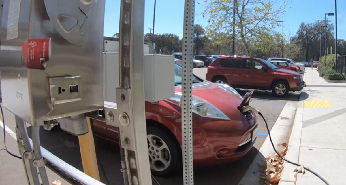 Electric vehicles plugged in to charging stations at UC San Diego's campus